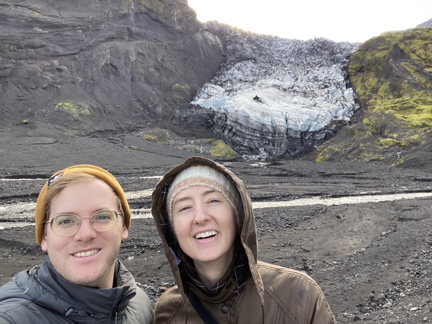Two travelers below the Eyjafjallajokull glacier
