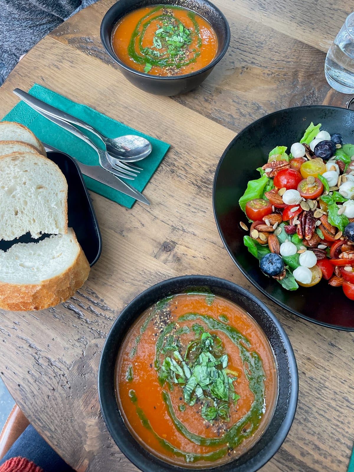 A spread of tomato dishes and fresh bread on the table at Fridheimar