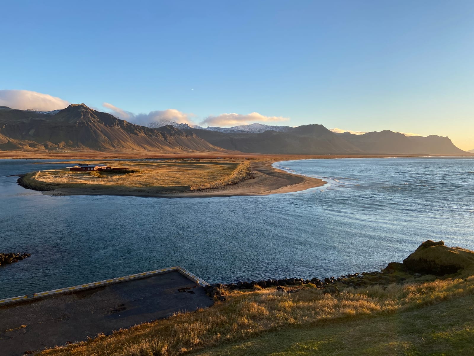 Golden evening light over the beach and mountains at Budir on Snaefellsnes