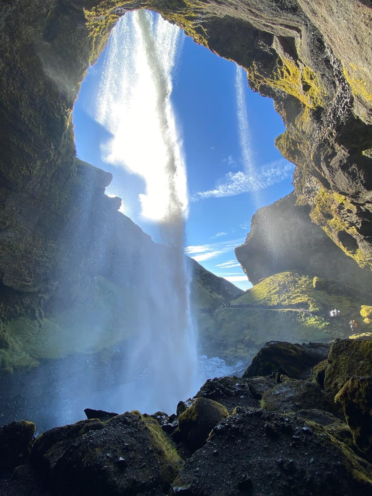 Scrambling up the wet gorge toward the falls at Nauthusagil