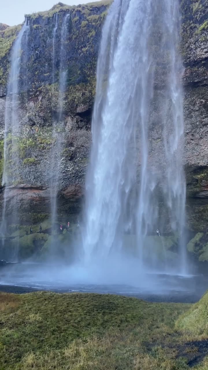 Standing under Seljalandsfoss.
