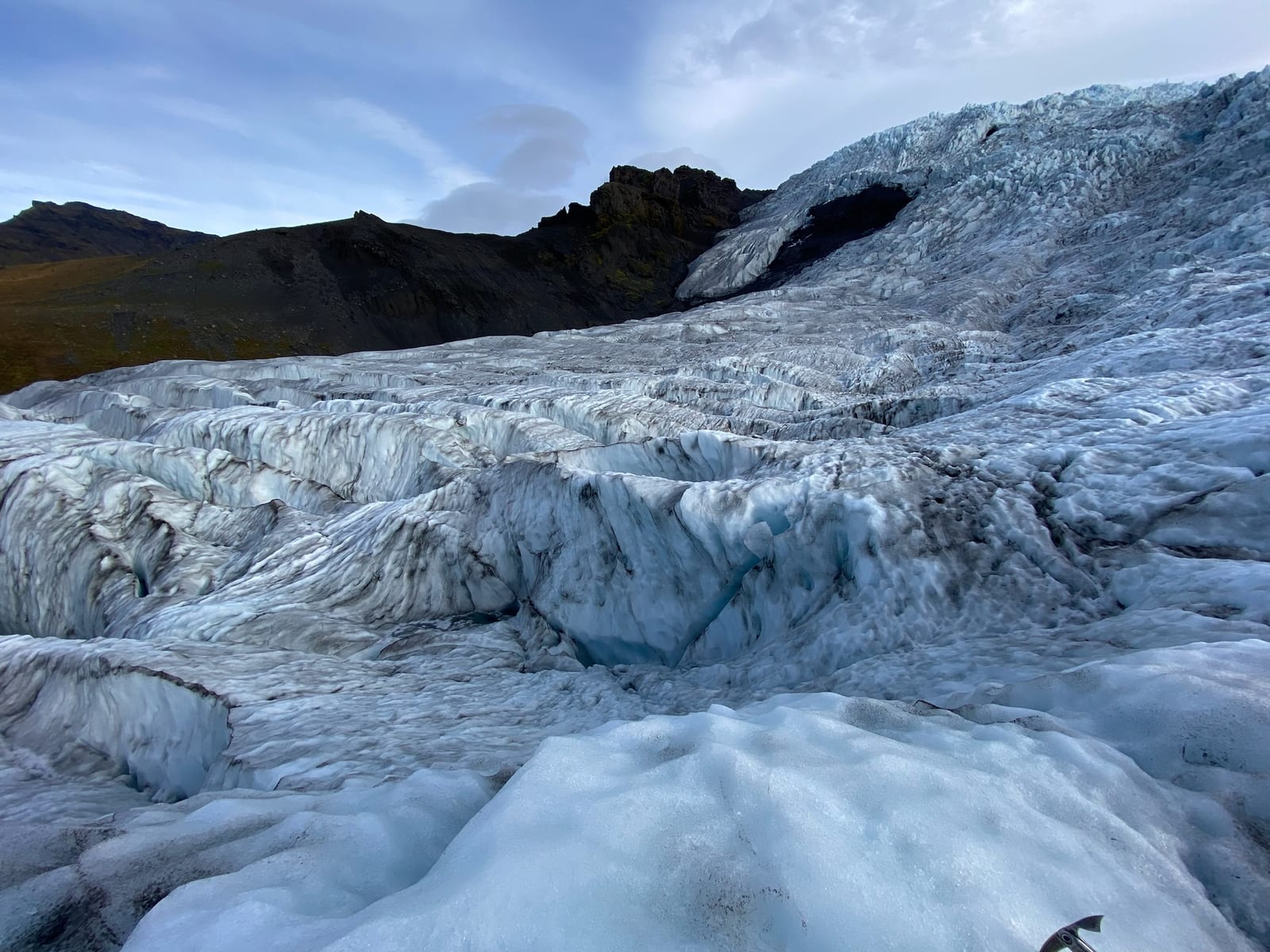 A guided group roped up and walking out across the Vatnajokull glacier ice