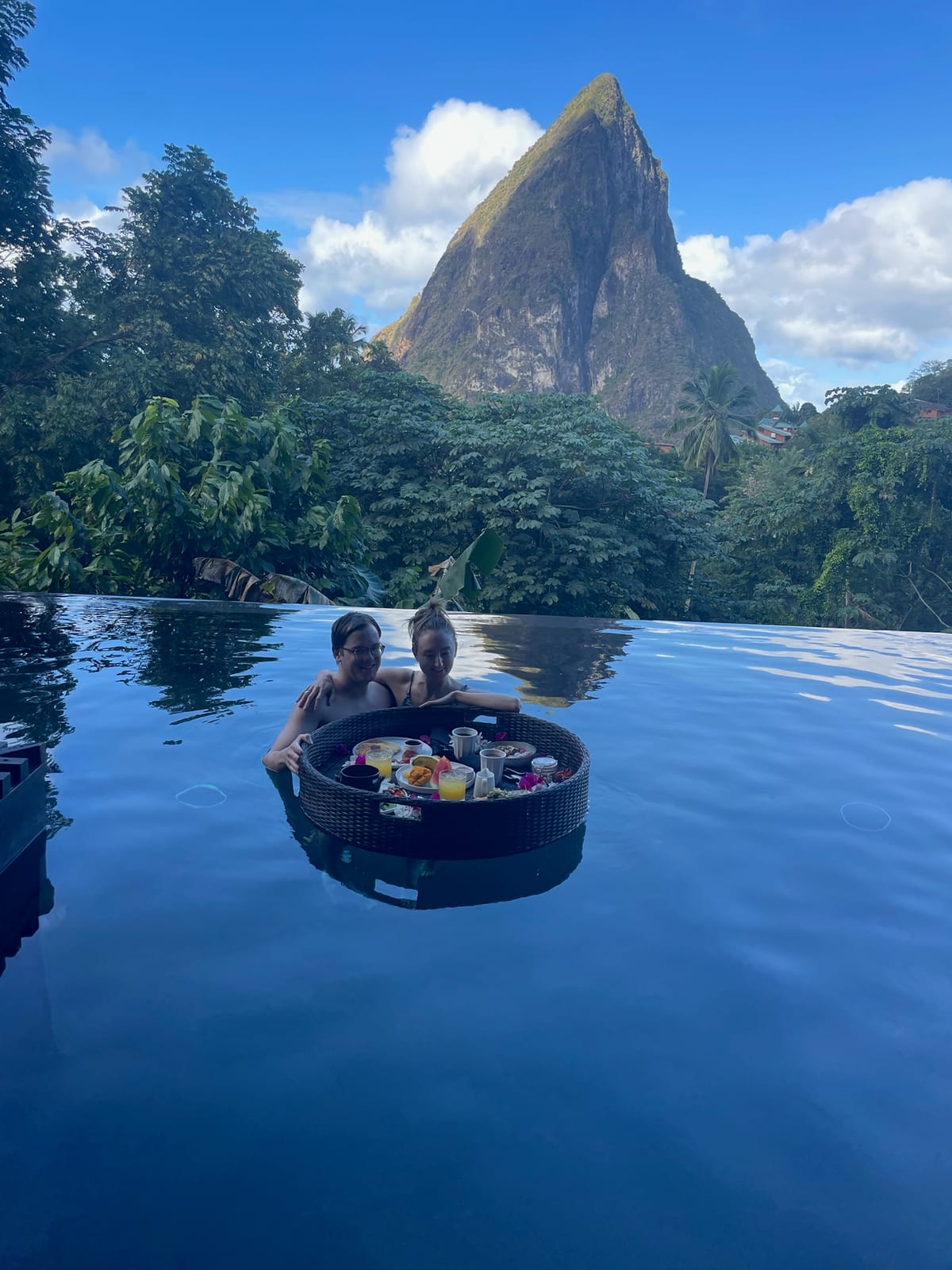 A floating breakfast tray in the infinity pool with a Piton behind at Rabot Restaurant